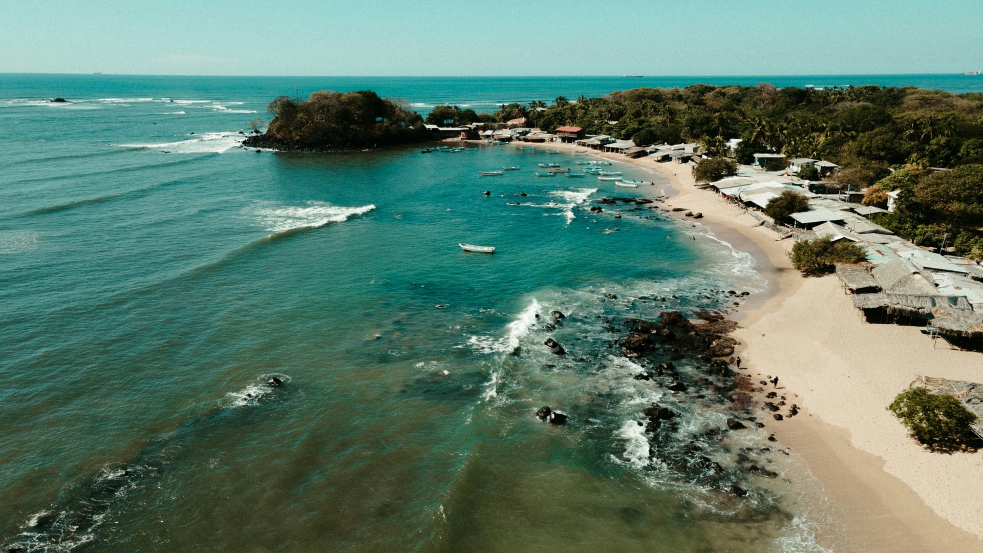 The black-sand Pacific coast at El Zonte, the home of Bitcoin Beach.
